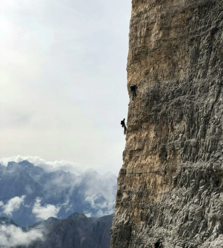 Man climbing steep rocky mountain wall, Faith and Sex: a how to guide for porn recovery and real change